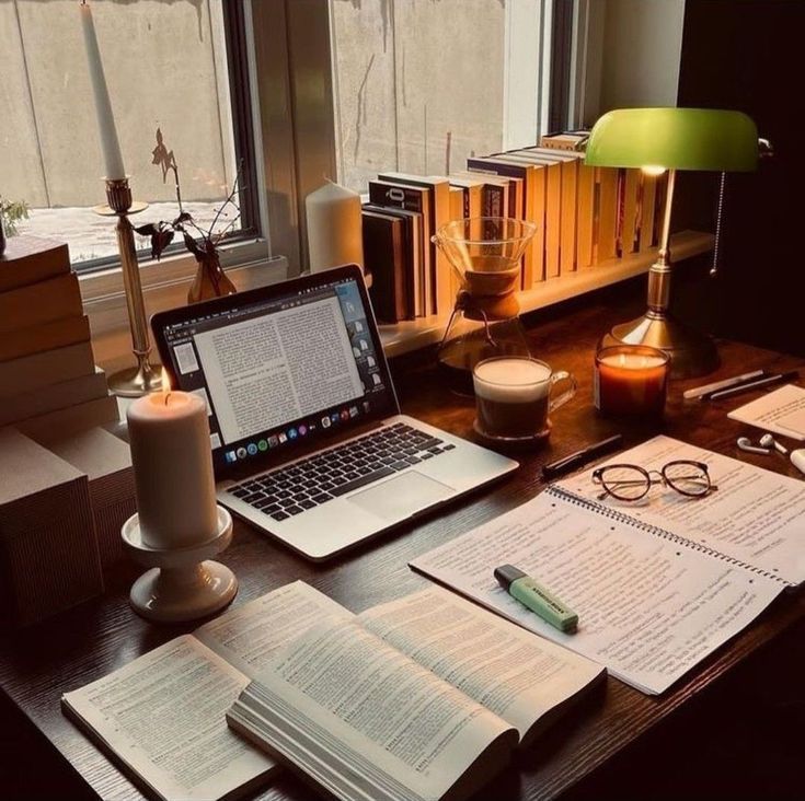Working desk with books and laptop